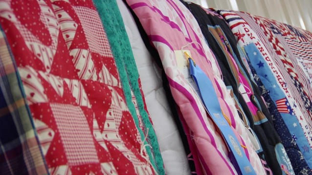 quilt with blue ribbon